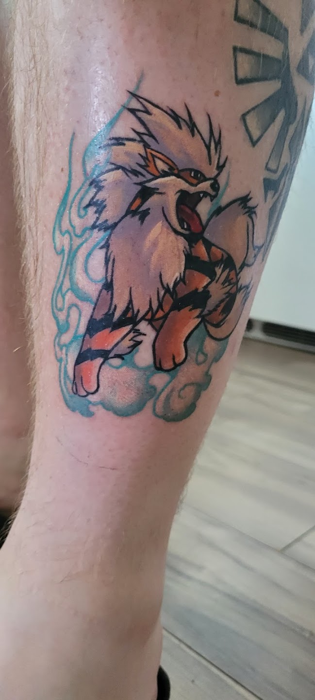 Colorful animal tattoo on leg