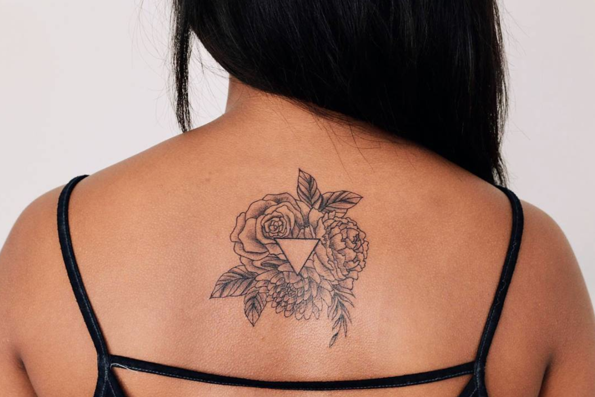 Floral geometric upper back tattoo