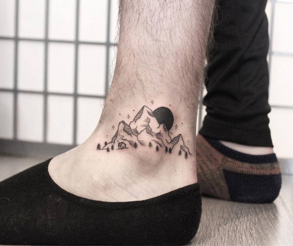 Mountain landscape ankle tattoo